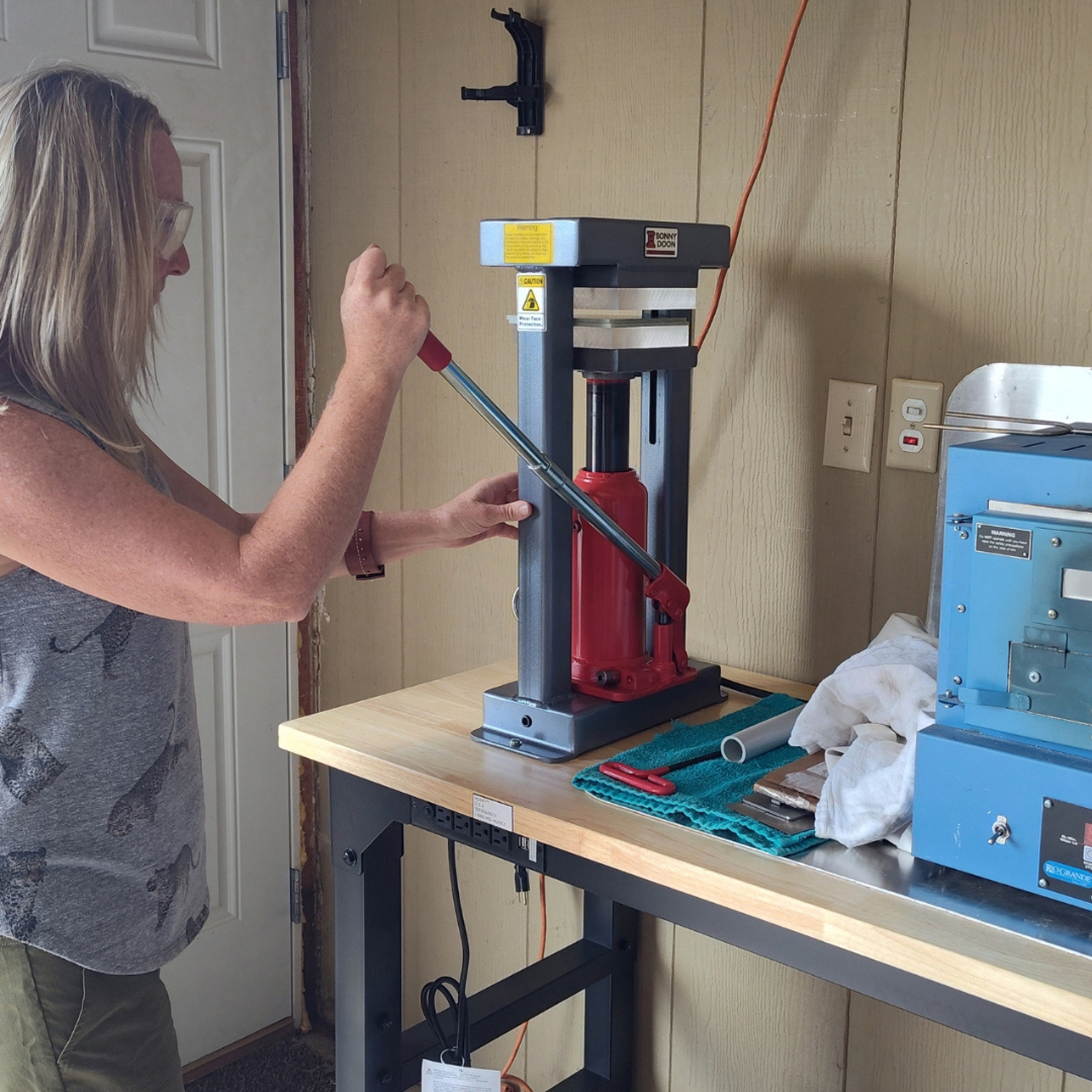 Hilarie at the hydraulic press
