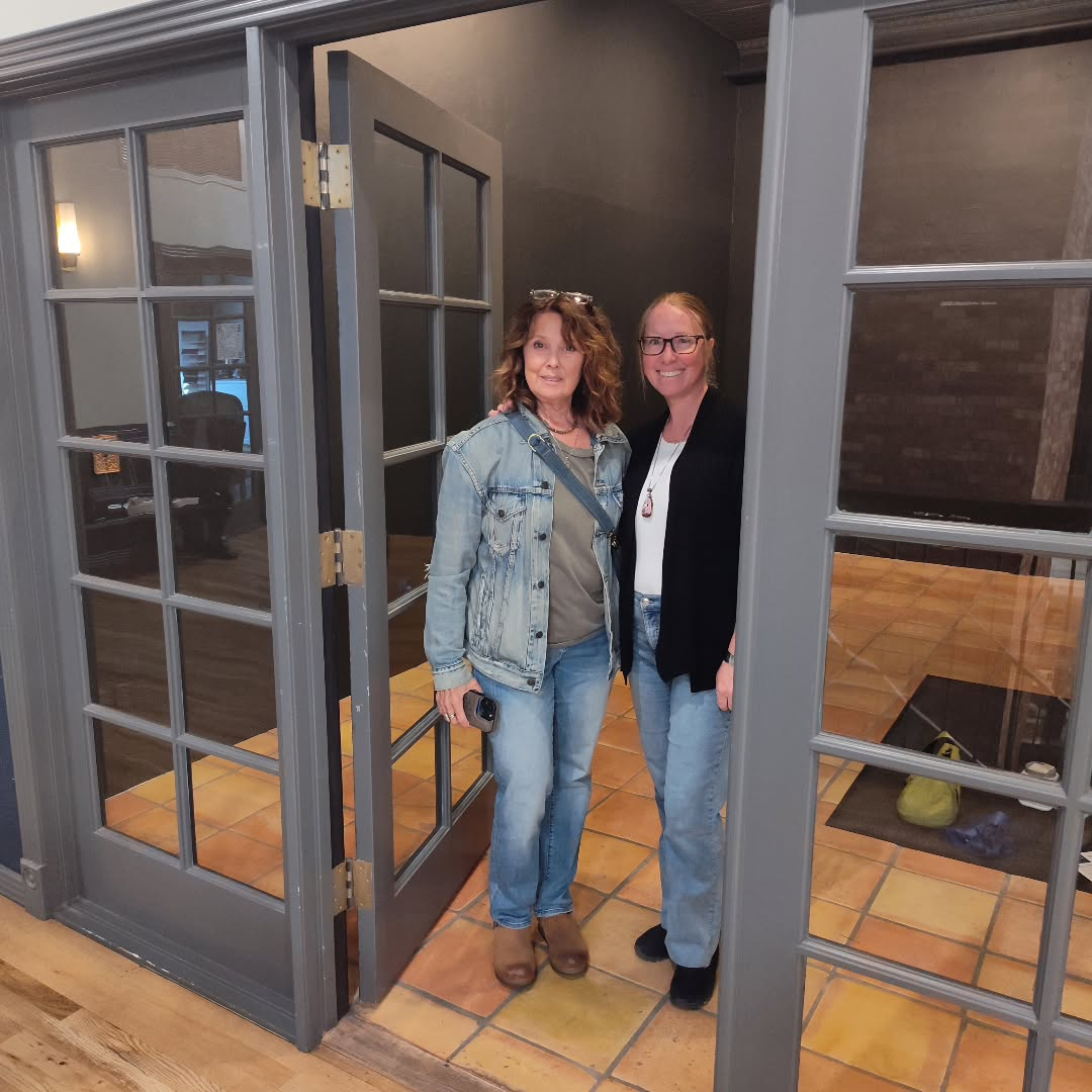 Mandy and Hilarie standing in the shop entrance